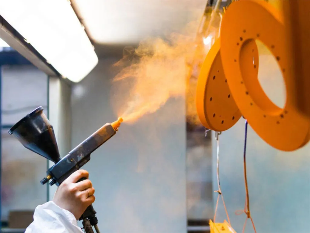 Applying a real metal spray coating to a rigid substrate in Lazlo's workshop